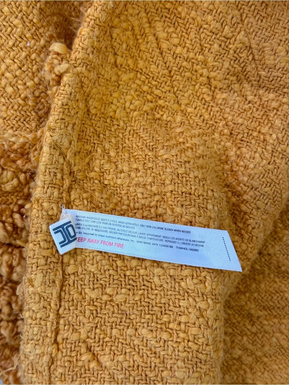 Urban Outfitters Aden Tufted Throw Blanket in Mustard